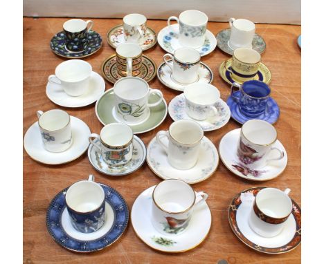 A quantity of miniature cups, saucers and coffee cups to include examples by Aynsley, Royal Doulton, Wedgwood etc.