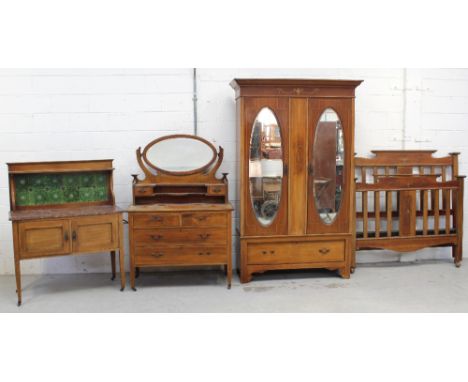 An Edwardian mahogany four-piece bedroom suite, with chevron line inlay, comprising dressing chest, marble-topped wash stand 