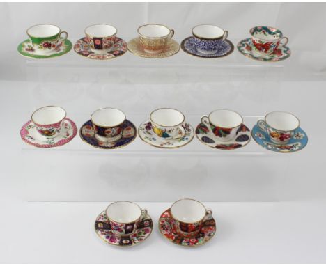 Twelve miniature Royal Worcester cups and saucers to include 'Marchioness of Huntley', 'Springs of Flowers', 'Jabberwocky', '