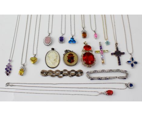 A quantity of silver and white metal jewellery to include silver pendants, a cross with amethyst-coloured stone, a silver cro