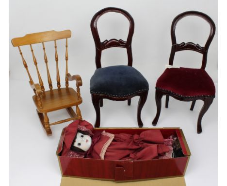 A pair of miniature decorative Victorian dining chairs, a miniature rocking chair used for displaying teddy bears or dolls an