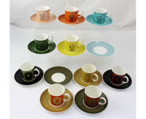 A quantity of Susie Cooper coffee ware comprising ten cups and twelve saucers.