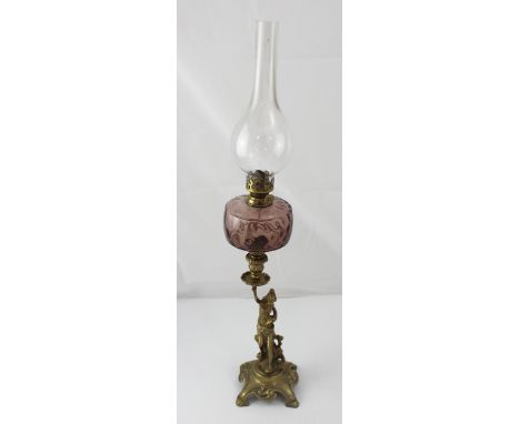 A Victorian brass and amethyst glass oil lamp, the base modelled as a seated woman, height 71cm. CONDITION REPORT Age-related