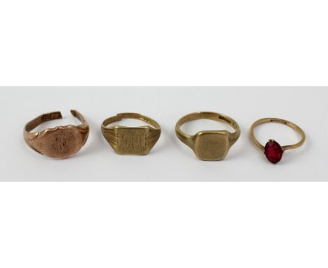 A 9ct yellow gold red stone set solitaire ring, size M, two 9ct gold signet rings (one af) and a rose gold example (af), appr