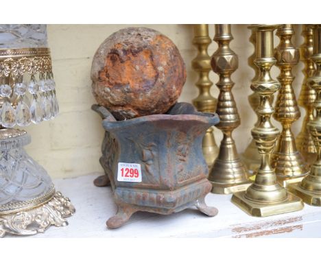 An antique 8lb cannonball; together with a cast iron planter. 