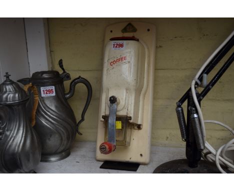 A vintage 'De Ve' coffee grinder.