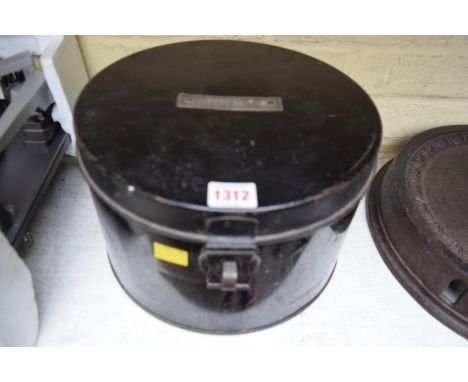 An antique black tin hat box, with a brass plaque to the top described 'R Miller'. 