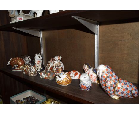 Eleven Royal Crown Derby paperweights, to include two seconds, one lacking stopper.    Condition Report:  No visible sign of 