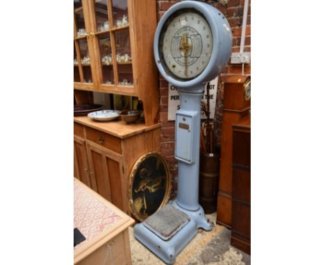 A vintage pale blue enameled Avery 'Penny in Slot' weighing machine, 183cm high.By repute from Brighton seafront. 