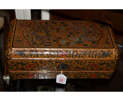 A Chinese brown lacquer rectangular box and cover, with cusped corners, the top decorated with two five-clawed dragons and a 