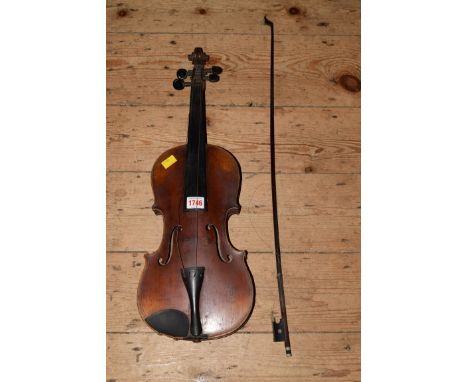 An unusual antique Continental violin, the 14 inch back with stained and inlaid decoration, with bow and ebonized case. 