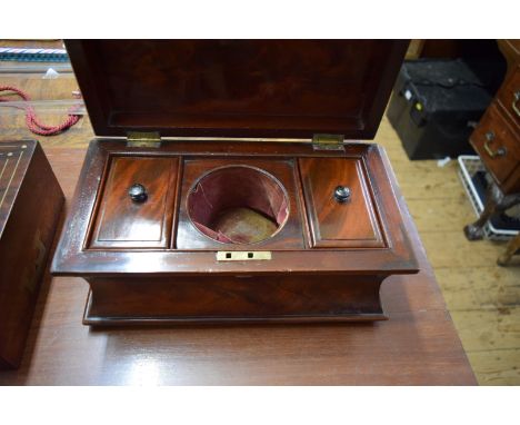 A Victorian figured mahogany tea caddy, of waisted sarcophagus form, 34cm wide. 