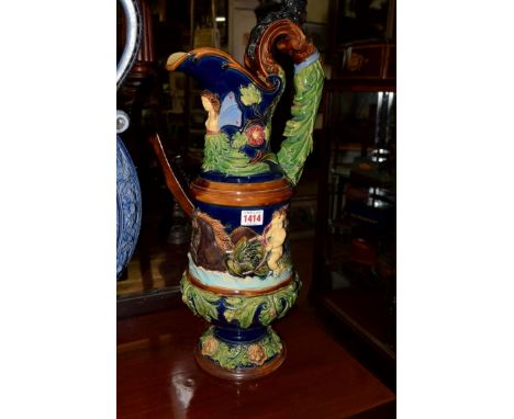 An antique Continental large majolica ewer, impressed initials 'R H T' to base, 58cm high. 