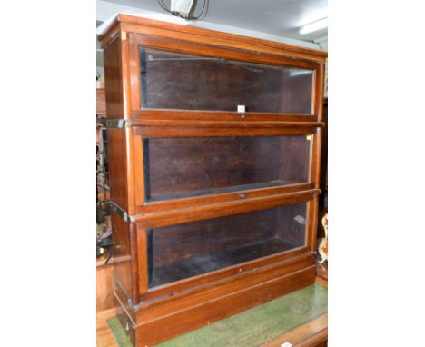 An early 20th century Globe Wernicke style mahogany three tier sectional bookcase, 89cm wide. 