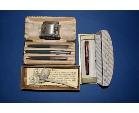A boxed Parker 61 pen set; together with a boxed Waterman pen; a Ronson Diana lighter, boxed; a clay pipe and others. 
