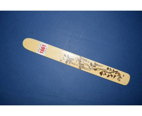 A Japanese ivory gilt decorated letter knife, 29.5cm long.   Condition Report:  Good with minor loss to the gilt decoration a