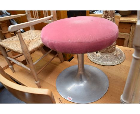A vintage aluminium and upholstered stool.