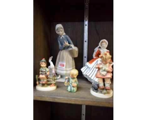 A Royal Doulton figure of 'Noelle', HN2179; together with a Lladro figure group; and three Hummel figures. 