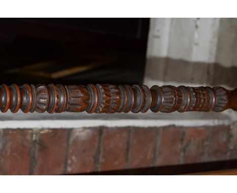 An unusual carved and turned wood tripod standard lamp.