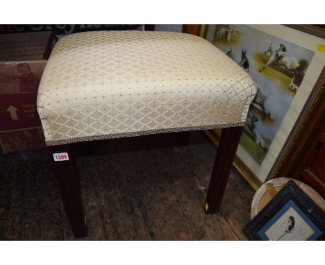 An antique mahogany and upholstered rectangular stool, on square moulded legs.