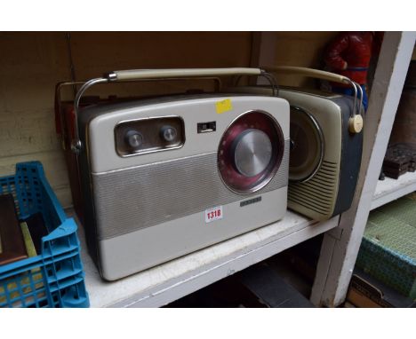Three vintage portable radios, comprising a Bush TR82C; a Hacker RP37A and a Baird.  