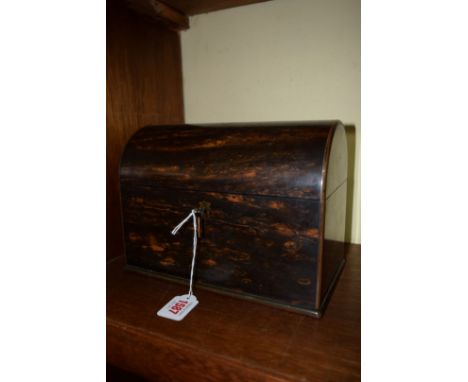 A good and unusual Victorian coromandel dome top tea caddy, the hinged top enclosing two conforming compartments with push bu