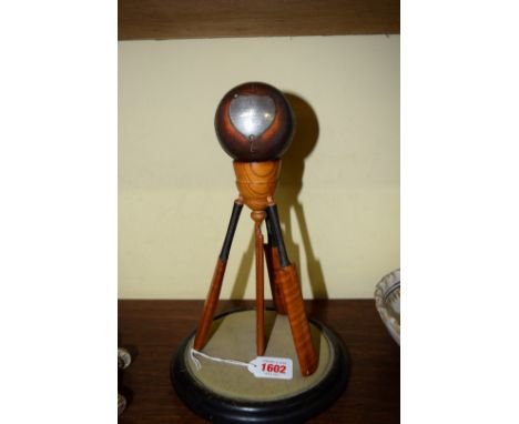 A good quality 1920s cricketing trophy, in the form of three bats and stumps supporting a ball bearing silver shield inscribe