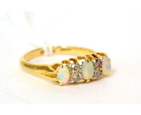 An opal and diamond ring, finger size O1/2 3.8g