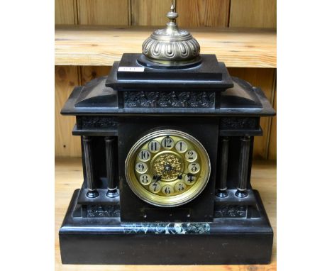 A black slate and marble mantel striking clock
