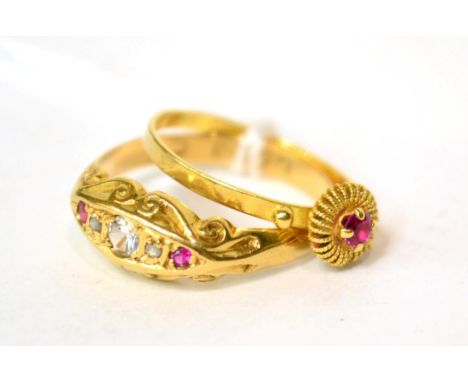 An 18ct gold ruby, white stone and diamond, finger size P and a ruby set ring, finger size M (2) 3.8g gross