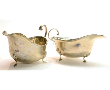A George VI silver sauceboat, ES Barnsley, Birmingham 1938, with flying scroll handle and three hoof feet, 15.5cm long; and a