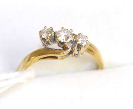 An 18ct gold diamond three stone ring, 0.25 carat approximately, finger size K 2.4g