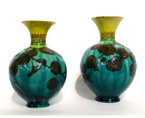 A Matched Pair of Linthorpe Pottery Vases, shape No.1810, decorated with leaves, on a turquoise and yellow ground, impressed 