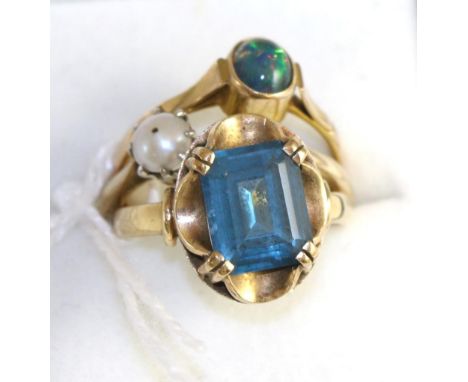 A blue topaz ring, an opal ring and a pearl ring (3)7.88g gross, size N, N and N 1/2 