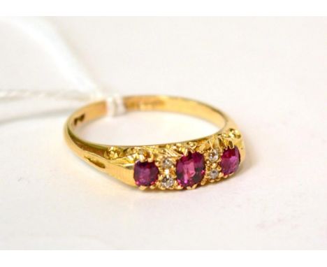 An 18ct gold ruby and diamond ring, finger size Q 4g