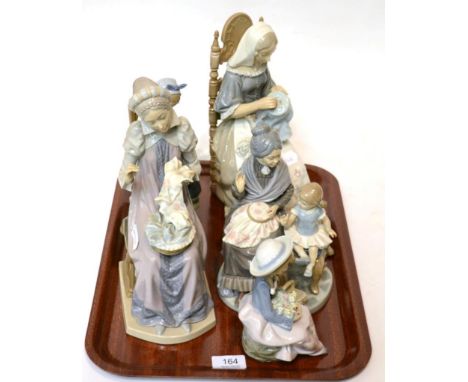Five various Lladro figures including lady's seated sewing etc (5) 