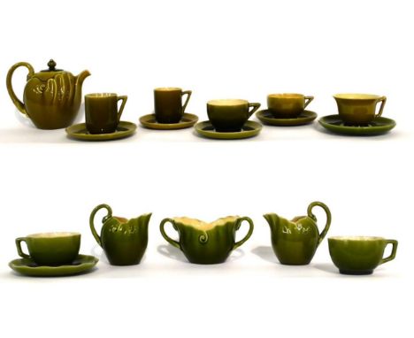 A Linthorpe Pottery Tea Pot, shape No.1246, olive glaze, 14cm; and A Group of Linthorpe Pottery Tea Wares, all olive glaze, v