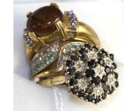 A 9ct gold opal and tanzanite ring, a 9ct gold sapphire cluster ring and a 9ct gold emerald and diamond ring (3)Gross weight 