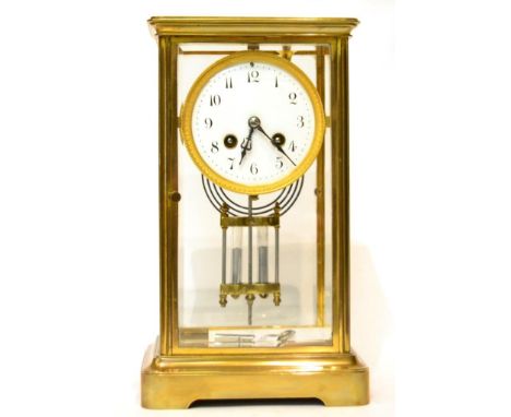 A brass four glass striking mantel clock 