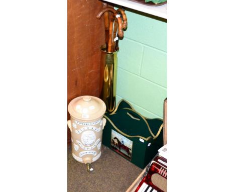 A Parkers patent Niagara filter Co, London stoneware water filter, a painted wooden newspaper rack, trench art brass stick st