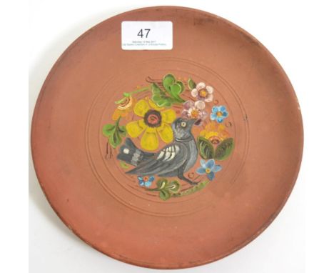 Christopher Dresser for Linthorpe Pottery: A Plate, shape No.353, unglazed earthenware painted with a bird in flowers, impres