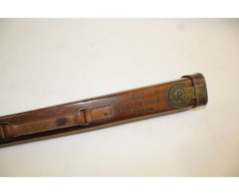 LEATHER GUN BARREL CASE - GUARDS CLUB a slender leather case for a spare Gun Barrel, with a brass lock and catch. Stamped, R.