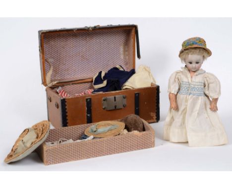 RARE JULES STEINER DOLL & DOLLS TRUNK a rare 19thc Series B doll, with fixed blue eyes, closed mouth and pierced ears. With a