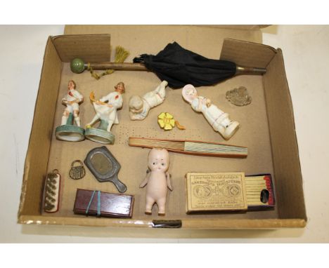 MINIATURE DOLLS ITEMS including a small bisque kewpie doll, miniature parasol, musical matchbox, dolls brush and mirror, mini