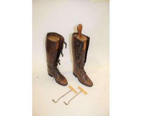 PAIR OF VINTAGE LEATHER BOOTS a pair of vintage leather boots with straps, both with vintage wooden trees (one tree with part