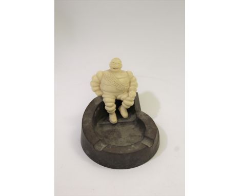 MICHELIN BAKELITE ASHTRAY - AUTOMOBILIA an advertising item showing the Michelin man (Mr Bibendum) mounted on a bakelite asht