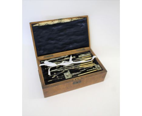 LARGE CASED GEOMETRY SET a large oak case with two removable trays containing a variety of instruments and some rulers, inclu