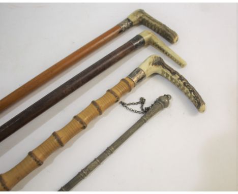 RIDING CROPS &amp; WHIP including a ladies whip with metal top and metal collars to the shaft, probably continental. Also wit