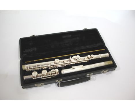 CASED FLUTE - BUFFET CRAMPON a flute in three sections and in a fitted case, the centre section marked Buffet Crampon, Evette