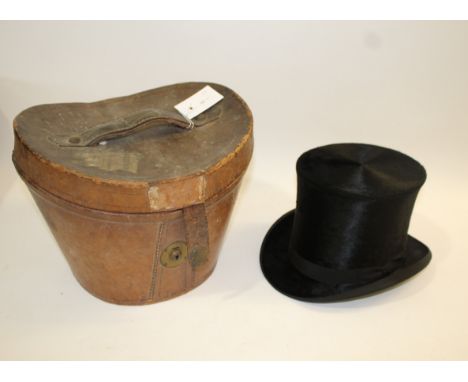 LEATHER CASED TOP HAT a vintage leather case with a lined interior, containing a black Top Hat by J McMillan Junr, High St, Y